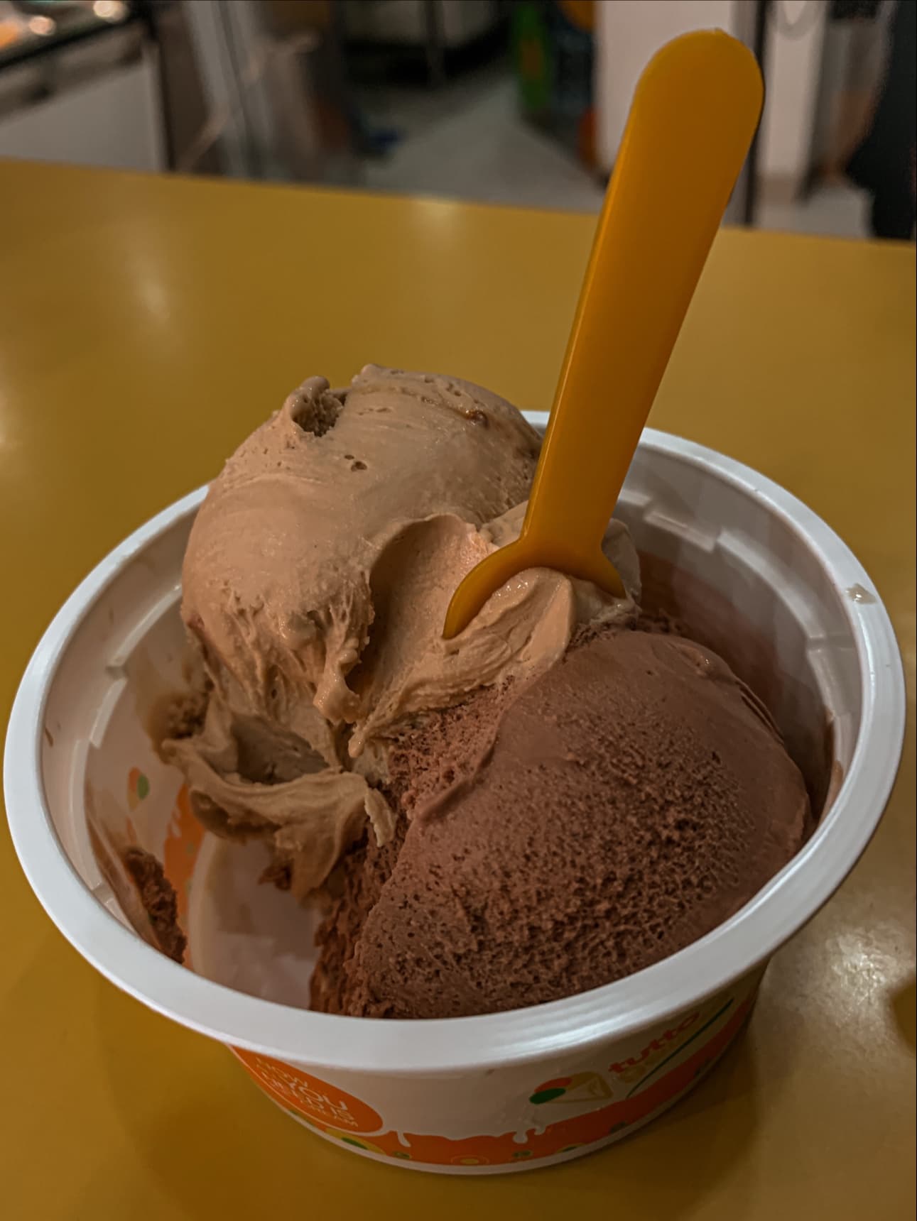 Chocolate gelato scoops in branded cup