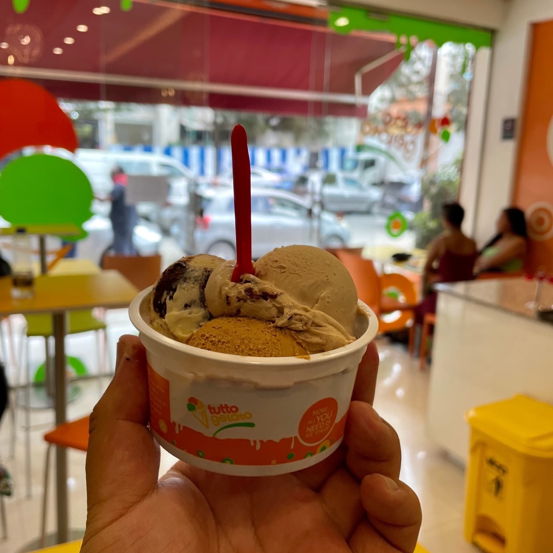 Triple scoop cup inside Tutto Gelato store